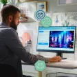 Jeune professionnel utilisant un outil d’intelligence artificielle générative sur ordinateur